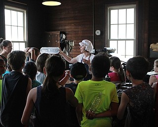 Neighbors | Abby Slanker.C.H. Campbell Elementary School third-grade students listened as Suzie McCabe, Canfield Historical Society president, explained how the presses worked in the press room of Mahoning Dispatch during the school’s annual Canfield History Walking Tour on May 29.