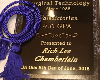 ROBERT K YOSAY  | THE VINDICATOR..Blue rope as Rich Lee Chamberlain Valedictorian received a plaque and rope for his accomplishment..Ford Family Recital Hall located in the DeYor Performing Arts Center. More than 60 full time students graduated from the three adult education programs offered at Choffin: 15 Dental Assisting students, 33 Practical Nursing students, and 18 Surgical Technology students..-30-