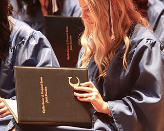 ROBERT K YOSAY  | THE VINDICATOR..Yep the name is spelled correct as Laura Manning checks her diploma..Ford Family Recital Hall located in the DeYor Performing Arts Center. More than 60 full time students graduated from the three adult education programs offered at Choffin: 15 Dental Assisting students, 33 Practical Nursing students, and 18 Surgical Technology students..-30-