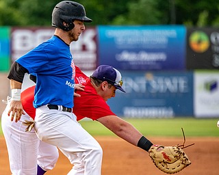 DIANNA OATRIDGE | THE VINDICATORÊ ÊBoardman's Evan Knaus is safe at first base for the Mahoning team after an errant throw to the Trumbull team's first baseman, AJ Meyer, from Champion during the All-Star Classic at Eastwood field in Niles on Friday.