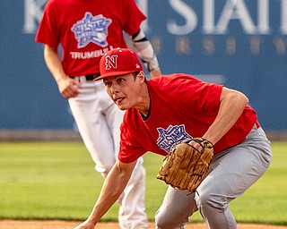 DIANNA OATRIDGE | THE VINDICATORÊ Niles' Luke Swauger barehands a grounder for the Trumbull team as his teammmate, Warren G. Harding's Nick Fitzgerald looks on during the All Star Classic at Eastwood Field in Niles on Friday.