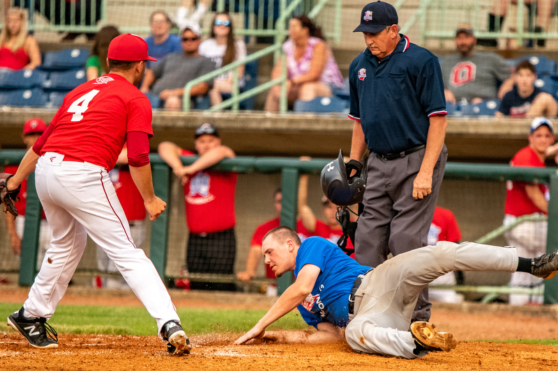 DIANNA OATRIDGE | THE VINDICATOR Springfield's Johnny Ritter, representing the Mahoning team, slides into home but is tagged out by Trumbull player, Sam Wells, from LaBrae during the All-Star Classic at Eastwood Field in Niles on Friday.