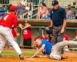 DIANNA OATRIDGE | THE VINDICATOR Springfield's Johnny Ritter, representing the Mahoning team, slides into home but is tagged out by Trumbull player, Sam Wells, from LaBrae during the All-Star Classic at Eastwood Field in Niles on Friday.