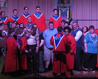 Neighbors | Zack Shively.Choir director William Klein invited the families of seniors on stage to recognize them. The students received flowers and congratulations from Klein. ddditionally, three seniors in the concert choir received three $1000 scholarships from the Parents' Club.