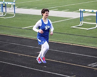 Neighbors | Submitted.Olivia Spencer, pictured running track, was sent to the emergency room at three months old because she stopped breathing. The experience left her with hemiplegic cerebral palsy. Through years of physical therapy, she learned to run. She now runs for Poland's track team.