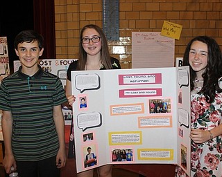 Neighbors | Abby Slanker.Canfield Village Middle School students, from left, Quinton Miller, Maddie McCartney and Kenzie Koenig, celebrated their Seventh Grade Lost and Found Project at the school’s second annual ACE celebration event on May 11.