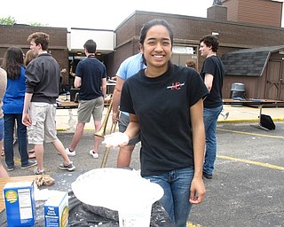 Neighbors | Zack Shively.The Science Jam featured a number of science displays, such as a group of dissected animal parts. Pictured, Charisma Ojeda held the oobleck that the students made. It is a non-Newtonian fluid that is liquid at rest and a solid in motion.