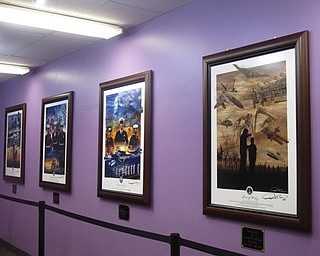 Neighbors | Zack Shively.Ray Simon's paintings hang in Fitch's Purple Star Room, a room dedicated to military veterans and students with military families. The painting commemorate the military. The room will also allow students with loved ones in the military to video chat with them.