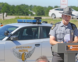 Ohio State Highway Patrol trooper Kenny Robinson talks about being hit twice while working on the highways. He participated in the Ohio Department of Transportation’s “Slow Down and Move Over” Thursday morning event.