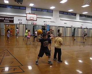 Neighbors | Zack Shively.The West Boulevard Elementary fourth-grade students spent hours with their teachers on May 31, the day before the students graduated from the school. Pictured, the students got a chance to play dodgeball against each other at one of the stations during the night.