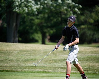 Zavier Bukan reacts to his put during the Greatest Golfer junior qualifier on Thursday at Trumbull Country Club in Warren.