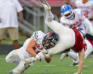 CANFIELD, OHIO - JUNE 14, 2018: Mahoning County's Will Dawson tackles Trumbull County's Evan Adair during the second half of the Jack Arvin All Star Football game, Thursday night at Canfield High School. DAVID DERMER | THE VINDICATOR