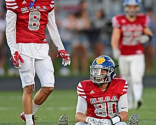 CANFIELD, OHIO - JUNE 14, 2018: Trumbull County's Drew Munno, right, sits on the ground after a incomplete pass on 4th and long late in the fourth quarter of the Jack Arvin All Star Football game, Thursday night at Canfield High School. DAVID DERMER | THE VINDICATOR..Anthony Backus pictured.
