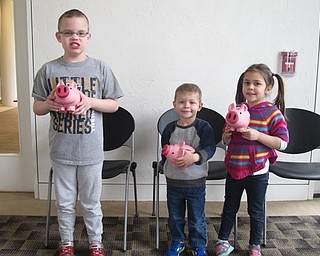 Neighbors | Zack Shively.The Austintown library had a "Smart Money Picture Bingo" program on April 28. The program was one of several "Smart Money" programs throughout the PLYMC in April. At each event, the PLYMC provided piggybanks for the children. Pictured are, from left, Johnathan Martin, Collin Chasko and Norah Chasko.