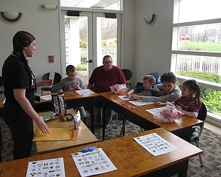 Neighbors | Zack Shively.The "Smart Money Picture Bingo" taught children how to recognize different types of money and how to play a couple styles of bingo. Librarian Taylor Cowles showed pictures of money, which matched with pictures on the bingo cards.