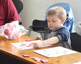 Neighbors | Zack Shively.The "Smart Money Picture Bingo" helped children learn finacial literacy through the fun activity of bingo. They played multiple games and received a treat when they won the game.