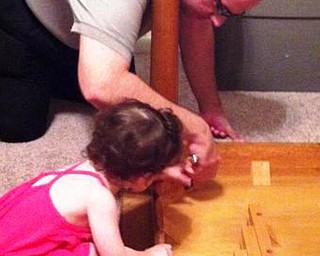 Samantha Guerrieri was 2 when she pitched in to help her father, Vince Guerrieri, fix the dining room table. Samantha is now 6, and her grandmother, Rose Guerrieri, entered the photo for her.
