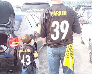 On  tailgate duty at a Pittsburgh Steelers game were the Johnsons, Kevin Sr. and Kevin Jr. The photo was sent in my wife and mom Jennifer Johnson.
