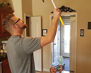 Joe and Sharmon Lesnak of Youngstown sent in this photo of their firstborn, Nathan Lesnak doing a bit of housecleaning with his firstborn son Shalyn offering a helping hand. Nathan and Shalyn live in Christaina, Tenn.
