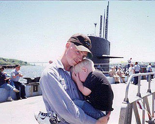 Jake McCracken holds his son, Jonathan McCracken. McCracken served on a submarine, and Jonathan says he always made up for lost time and has never stopped doing his job as a dad even when out to sea.
