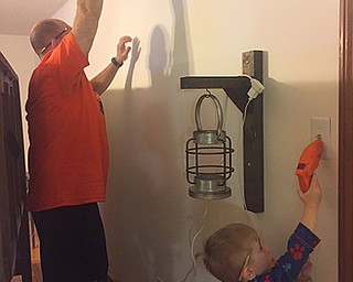 Every father could use a little help at times, as Scott Thompson found out when his son Jaxon, 3 1/2, got out his toy drill and put a pencil behind his ear to lend a hand. Wife and mother Liz Thompson sent in the photo.
