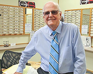 Emmett Woodrum is retiring from Optical Solutions in Austintown after a 58-year career in opticianry. Friends and well-wishers had a party for him Friday.
