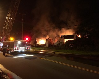 A warehouse at 1127 Poland Avenue caught fire at about 10 p.m. Friday, possibly because of motor vehicles stored inside.