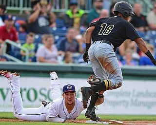 NILES, OHIO - JUNE 15, 2018: Mahoning Valley Scrappers' Henry Pujols, left, shows the ball to the umpire after unsuccessfully attempting to tag out West Virginia Black Bears' Edison Lantigua in the second inning, Friday night at Eastwood Field. DAVID DERMER | THE VINDICATOR