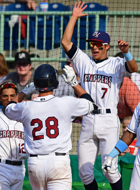 NILES, OHIO - JUNE 17, 2018: Mahoning Valley Scrappers' Simeon Lucas is welcomed back to the dugout by Tyler Freeman, right, after hitting a solo home run in the sixth inning of a baseball game against the West Virginia Black Bears, Sunday afternoon. The Scrappers won 10-9. DAVID DERMER | THE VINDICATOR