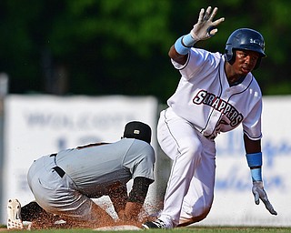 NILES, OHIO - JUNE 17, 2018: Mahoning Valley Scrappers' Miguel Eladio slides into second base for a double beating the tag from West Virginia Black Bears' Melvin Jimenez in the sixth inning of a baseball game, Sunday afternoon. The Scrappers won 10-9. DAVID DERMER | THE VINDICATOR