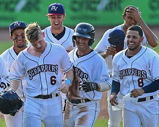 NILES, OHIO - JUNE 17, 2018: Mahoning Valley Scrappers' Mitch Reeves reacts after receiving a Gatorade bath while being mobbed his teammates Gian Paul Gonzalez, Clark Scolamiero and others after hitting a game winning single in the ninth inning of a baseball game against the West Virginia Black Bears, Sunday afternoon. The Scrappers won 10-9. DAVID DERMER | THE VINDICATOR