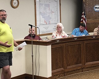 Village resident Robert Shaffer speaks in support of the TJX distribution center project Monday. Council is considering ordinances to rezone seven parcels, totaling 290 acres, on Ellsworth Bailey and Hallock Young roads from residential to industrial.