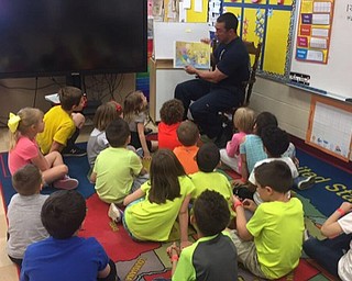 Neighbors | Submitted.The elementary schools invited guest readers to their school during Right to Read Week. These guests included board members and central office members with the district. Stadium Drive Elementary brought in over 20 guests, which included drag racer Ryan Martino, policemen and firemen. Pictured, Youngstown fireman George Zordich read to students at Stadium Drive Elementary.