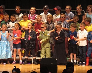 Neighbors | Zack Shively.Union Elementary's second-grade students sang and danced at their spring concert. Music teacher Dana Emery directed the students.