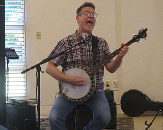 Neighbors | Zack Shively.Children's musician Jim Gill performed at the Austintown library June 15. Families attended the events together. The library often plays Gill's music at their Baby Brilliant children's programs. Pictured, Gill strummed his banjo and sang a song.