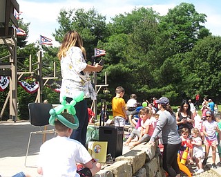 Neighbors | Jessica Harker .Anne-Marie Turner read “Llama Llama Red Pajama,” to guests at the Preschoolers in the Park event on June 12.
