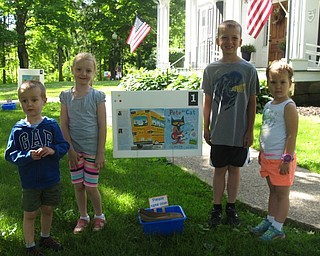 Neighbors | Zack Shively.The Poland library hosted a Storywalk on the lawn in front of the Town Hall building across from the library on June 12. The children and families at the event walked around the lawn to read a full story. Pictured are, from left, Liam and Lucy Crowe and Dillion and Olivia Kusky at the walk.