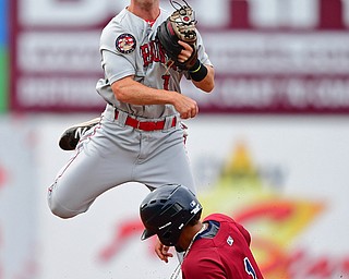 NILES, OHIO - JUNE 21, 2018: Auburn DoubleDays' Phil Caulfield throws to first after forcing out Mahoning Valley Scrappers' Elvis Perez in the third inning of a baseball game against the Auburn DoubleDays at Eastwood Field in Niles. DAVID DERMER | THE VINDICATOR