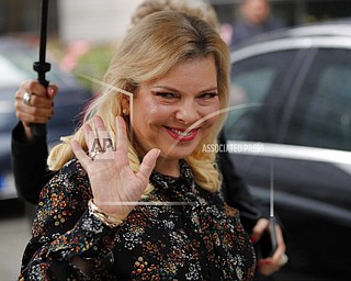 In this Wednesday file photo, Israel's Prime Minister's wife Sara Netanyahu arrives for the meeting with French Finance Minister Bruno Le Maire at Bercy Economy Ministry, in Paris. Israeli prosecutors have charged  the prime minister's wife with a series of crimes including fraud and breach of trust. 