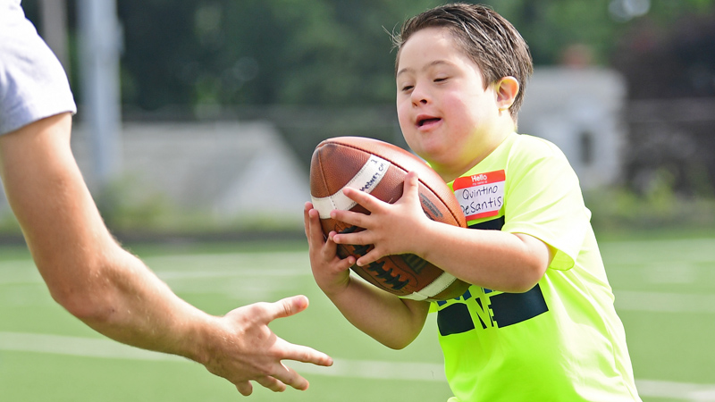 Quintino DeSantis was one of the youngsters who participated in the first day Cardinal Mooney High School's 18th annual Camp of Champions at Cardinal Mooney Football Complex on Monday. Bo Pelini, Youngstown State University head coach, members of his staff and others were on hand to coach students in grades three through eight.