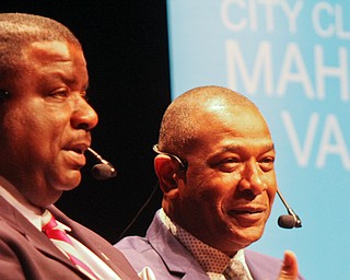 Youngstown Mayor Jamael Tito Brown, left, and Warren Mayor Doug Franklin participate in a City Club of the Mahoning Valley forum Monday at Packard Music Hall in Warren. 