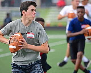 YOUNGSTOWN, OHIO - JUNE 25, 2018: JD Genova from Poland drops back to pass during a quarterbacks drill during the Mooney football Camp of Champions, Monday morning at Cardinal Mooney High School. DAVID DERMER | THE VINDICATOR