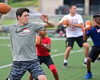 YOUNGSTOWN, OHIO - JUNE 25, 2018: JD Genova from Poland drops back to pass during a quarterbacks drill during the Mooney football Camp of Champions, Monday morning at Cardinal Mooney High School. DAVID DERMER | THE VINDICATOR