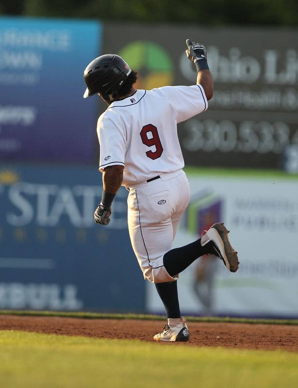 Scrappers catcher Jason Rodriguez thorws his arm in the air in celebration after hitting a solo home run in the bottom of the third inning during Monday evenings matchup against the Williamsport Crosscutters at Eastwood Field in Niles.