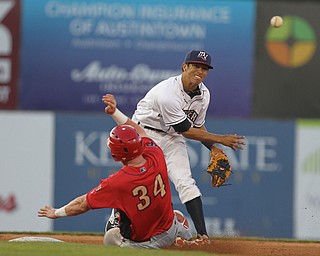 Scrappers second basemen Tyler Freeman (7) throws over Danny Mayer (34) of Williamsport to turn the double in the top of the sixth inning during Monday evenings matchup against the Williamsport Crosscutters at Eastwood Field in Niles.