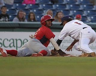 Elvis Perez (1) of the Scrappers dives back to third base to tag out Williamsport's Bryan Gonzalez (2) during Monday evenings matchup against the Williamsport Crosscutters at Eastwood Field in Niles.