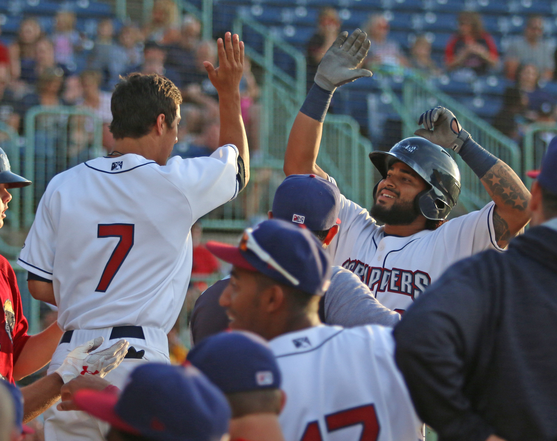 Scrappers catcher Jason Rodriguez (right) gets greeted by his teammate Tyler Freeman (7) as he returns to the dugout after hitting a solo home run in the bottom of the third inning during Monday evenings matchup against the Williamsport Crosscutters at Eastwood Field in Niles.