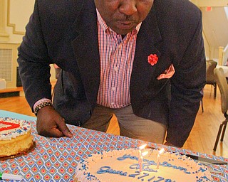 William D. Lewis The Vindicator   Youngstown Mayor Tito Brown blows out candles on a birthday cakeduring Birthday Party for Youngstown at the Tyler History Center 6-27-18.