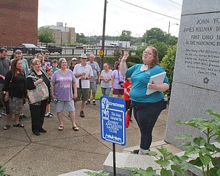 William D. Lewis The Vindicator  Traci Manning, curator of education at Tyler Mahoning Valley History Center, speaks to a gropup of people on a walking tour of downtown Youngstown as part of a birthday celebration for the city.