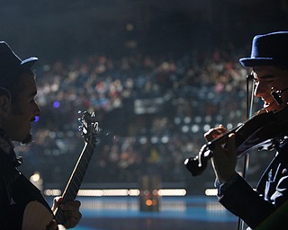 Camilo Motta, left, plays the guitar while Stepan Grytsay plays the violin before the start of Cirque Du Soleil Crystal in Covelli Centre on Wednesday.